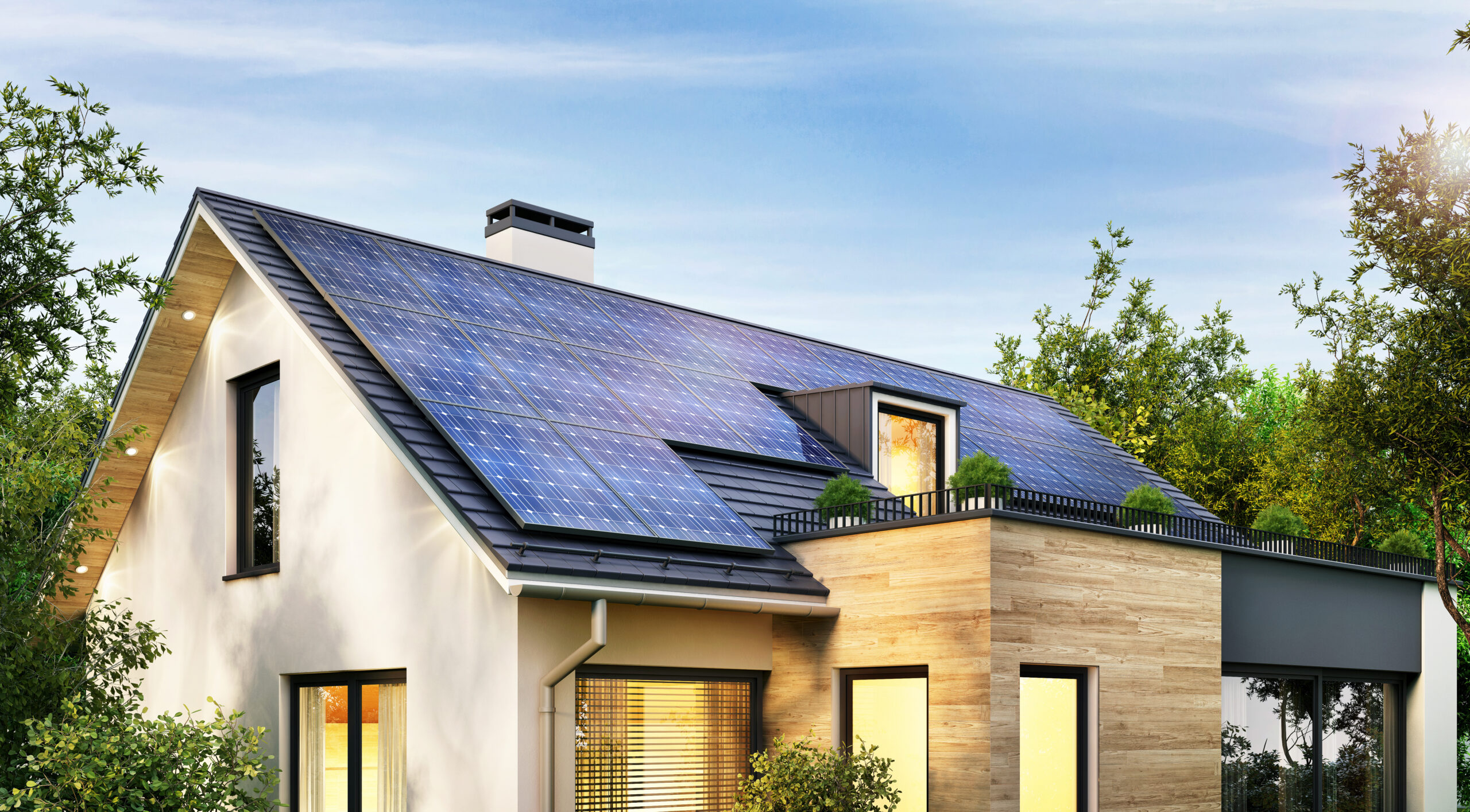 Modernes Wohnhaus mit Photovoltaikanlage in der Abenddämmerung